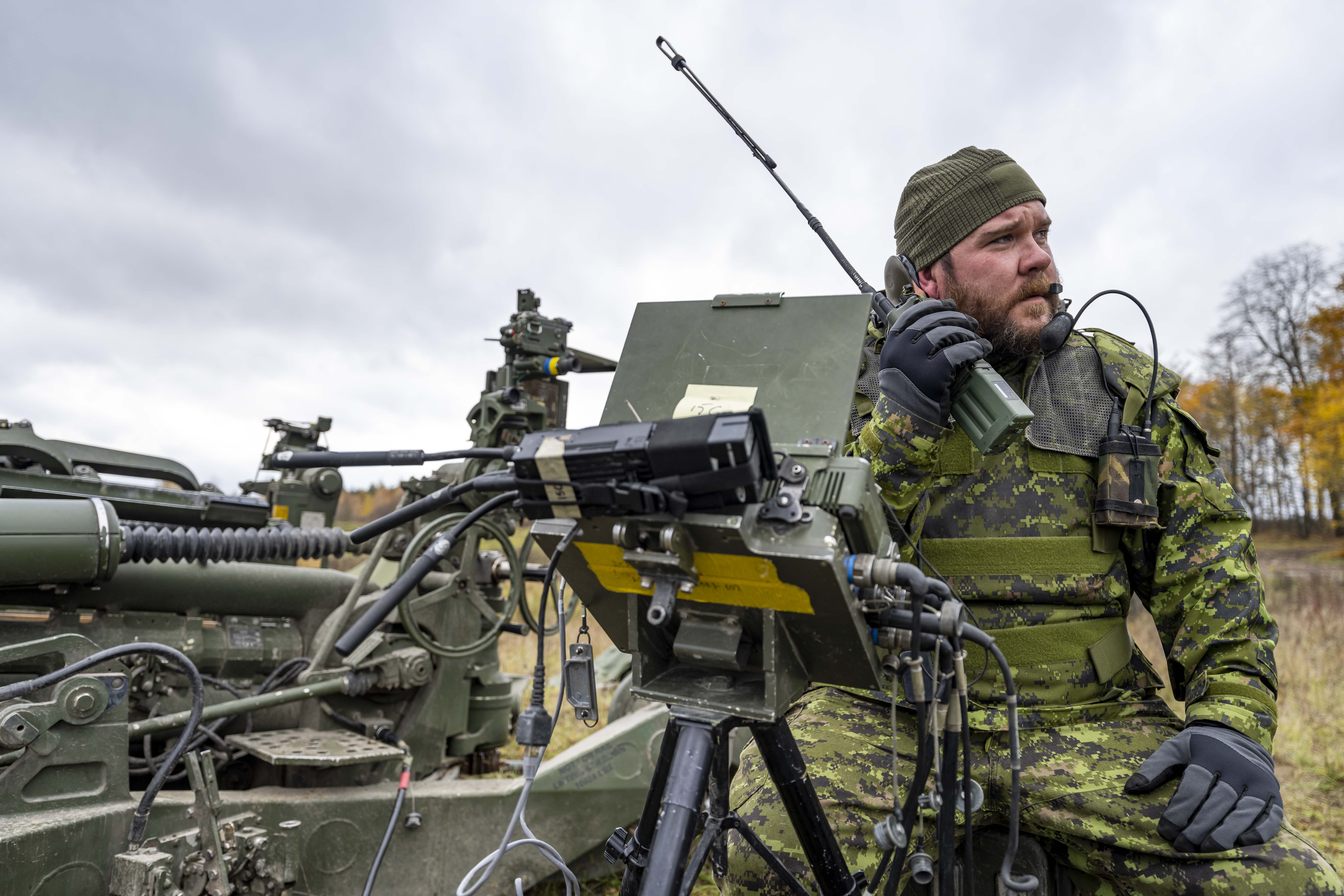 Soldier on radio in vehicle